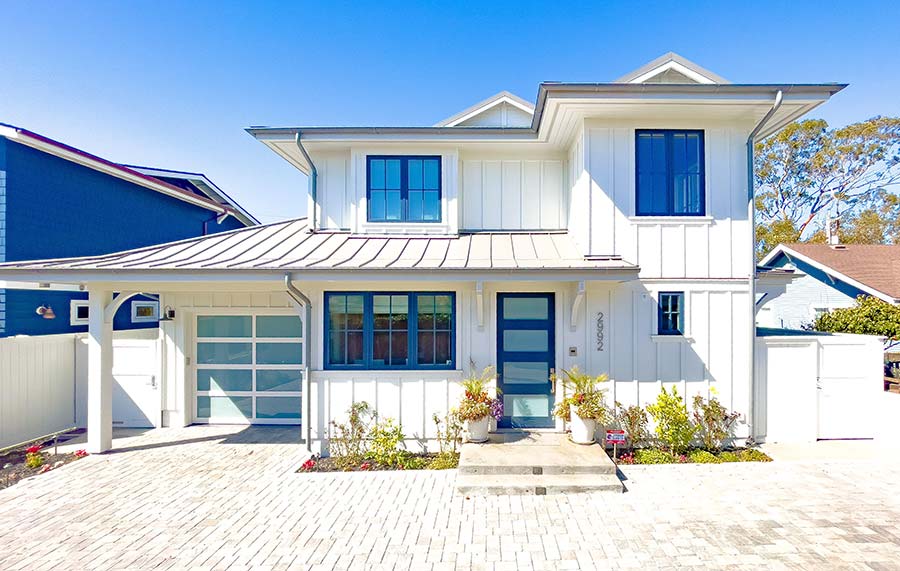 James Hardie panel siding board and batten style with V-groove soffited eaves