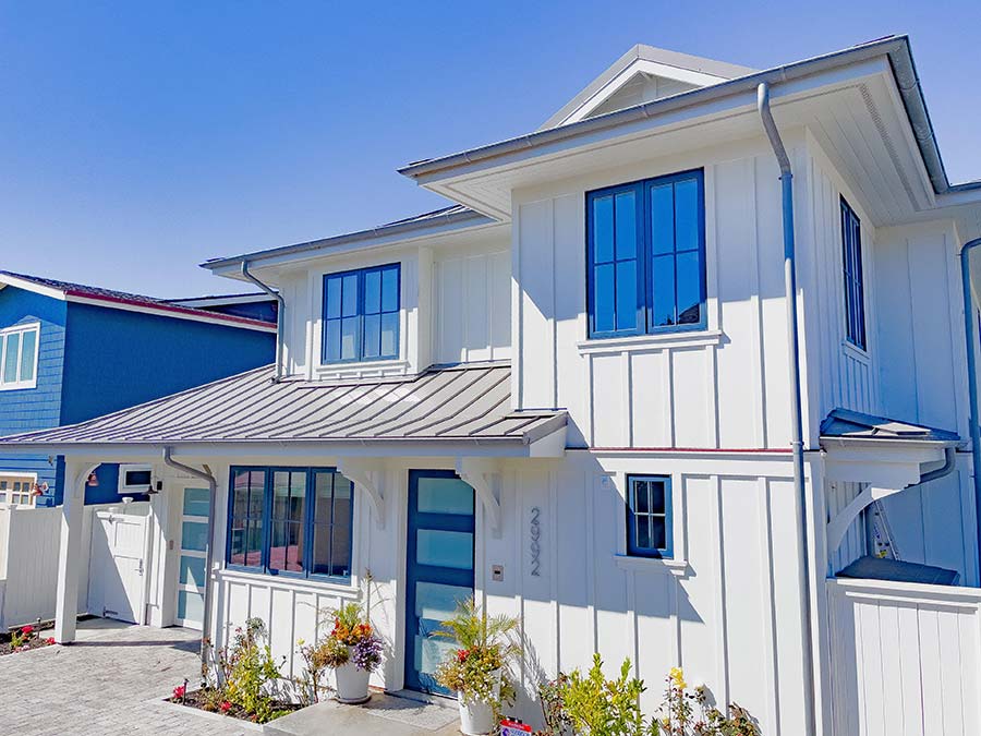 James Hardie panel siding board and batten style with V-groove soffited eaves