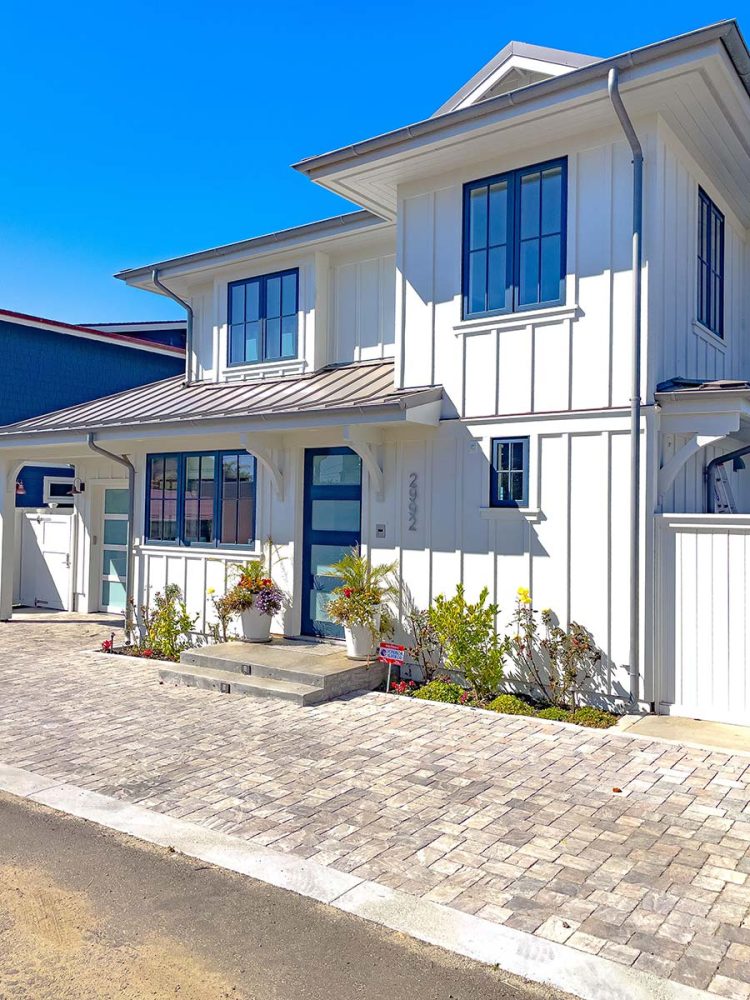 James Hardie panel siding board and batten style with V-groove soffited eaves.