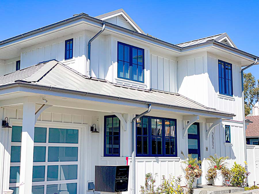 James Hardie panel siding board and batten style with V-groove soffited eaves.